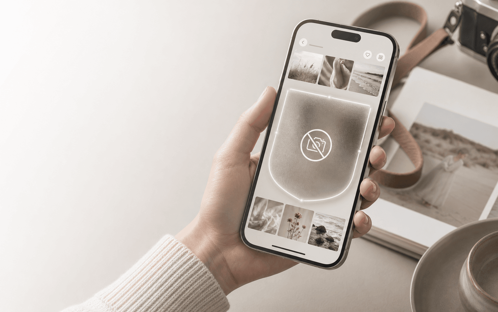 A photographer holding a phone with a protected client gallery